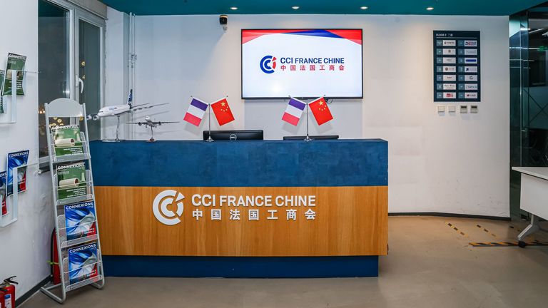 Reception desk and welcoming area at the CCI France Chine office in Beijing.