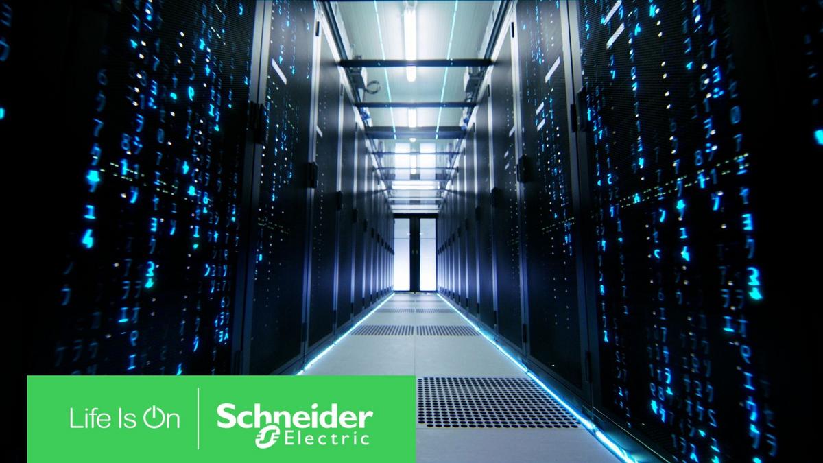 Illuminated server room hallway representing Schneider Electric digital solutions