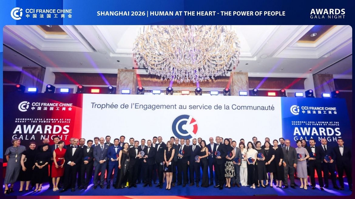 Group photo of all CCI France Chine Shanghai Gala 2026 award laureates on stage, under a large crystal chandelier, with the Human at the Heart theme displayed behind.